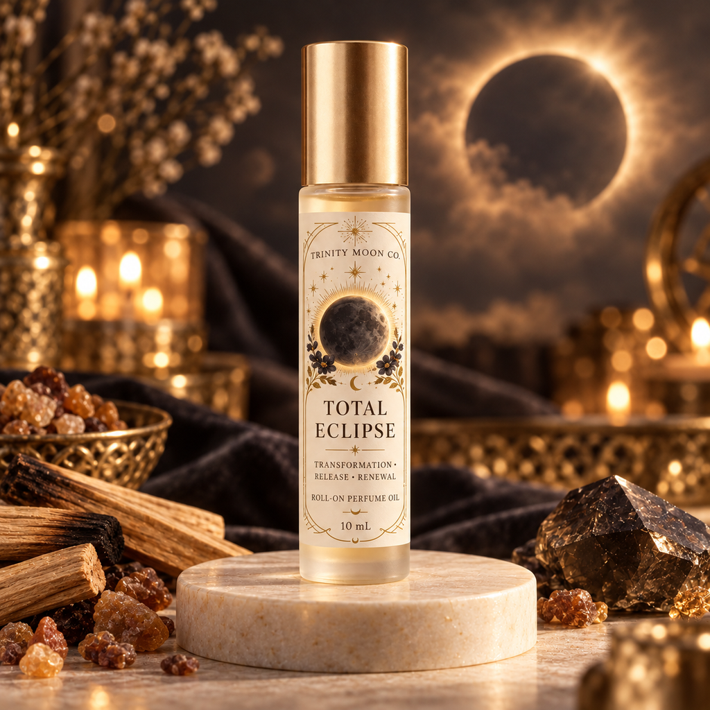 Total Eclipse by Trinity Moon Co., 10 mL roll-on packaging mockup with a cream celestial label and gold cap.