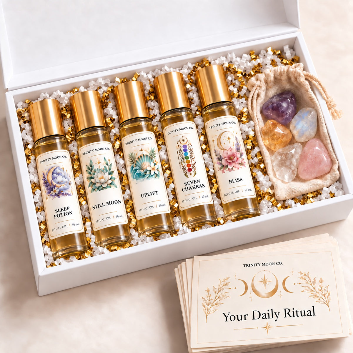 Wellness Ritual Box with five full-size 10 ml oils, corresponding crystals, and ritual cards.